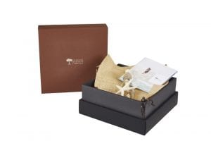 Popup Image: Turned edge box made of soft touch brown material with black collar.